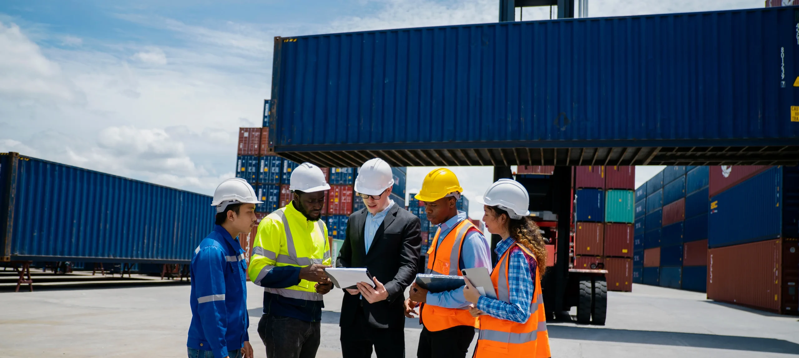 Manufacturing and supply chain workers at a shipping yard